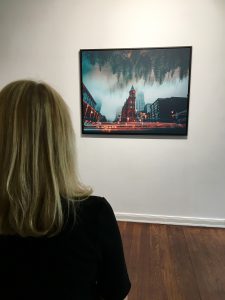 person in front of framed canva photo