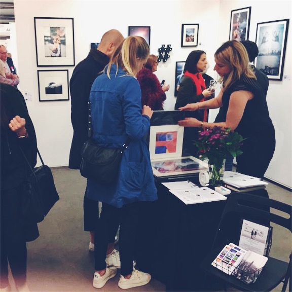 Affordable Art Fair Stockholm 2018 buyers in the booth of Social Media Art Gallery