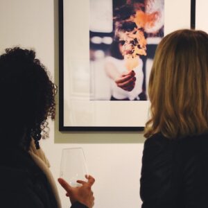Art buyer viewing artwork