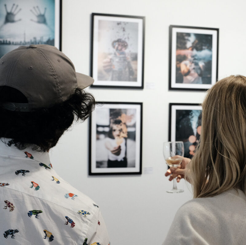 art lovers looking at limited artworks from cinnaavox