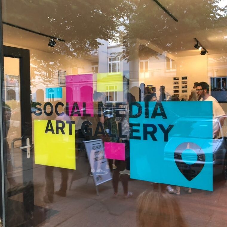 logo of social media art gallery at window during a pop-up event